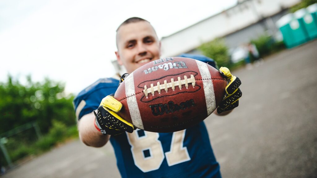 man holding football